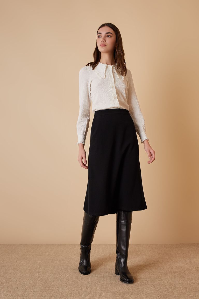 Black knee clearance length wool skirt