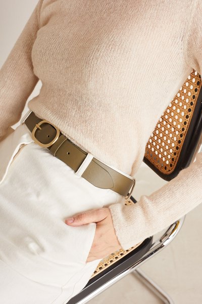 Leather belt with gold oval buckle