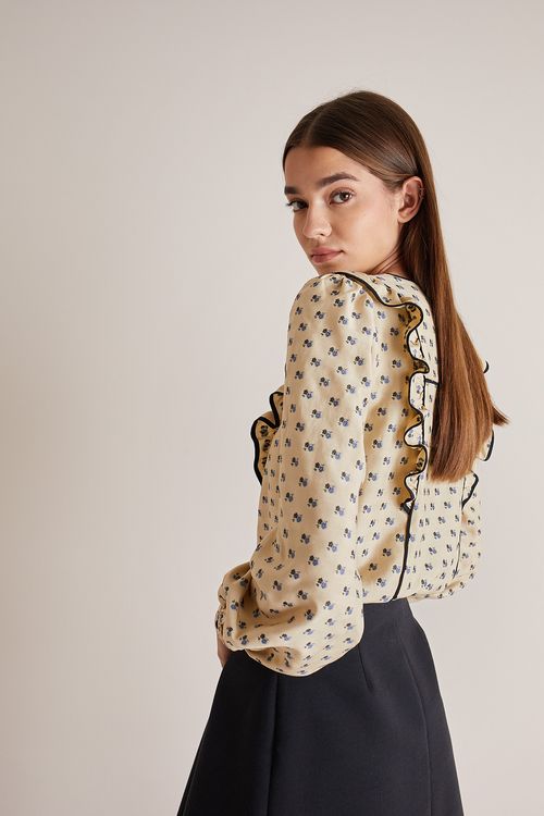 Blusa jacquard con profili a contrasto