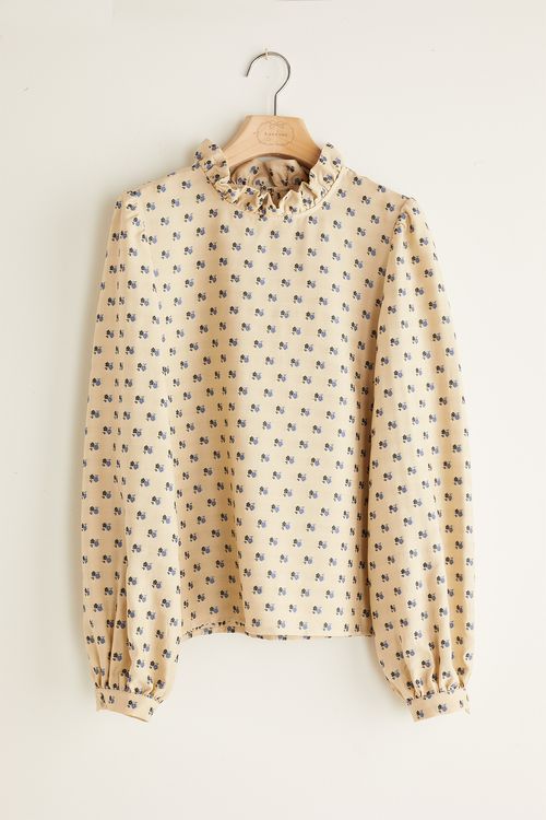 Blusa con fiorellini fil coupé
