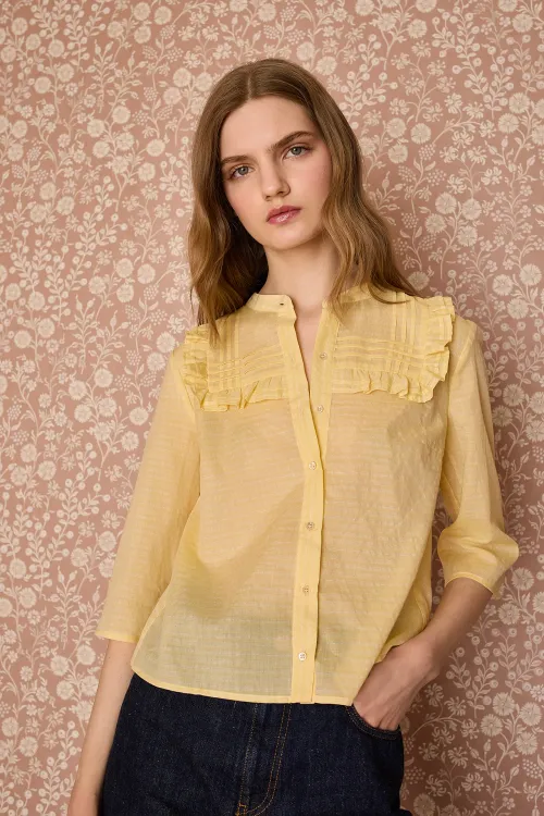 Shirt with ruffles and pleats