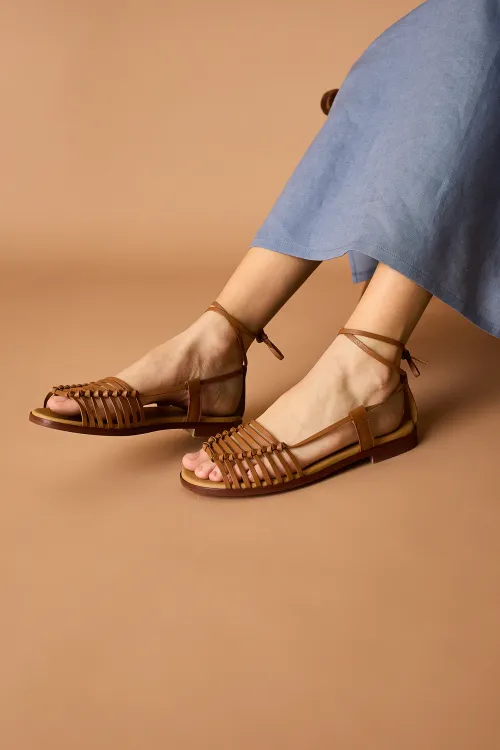 Kosma sandals tied at the ankle