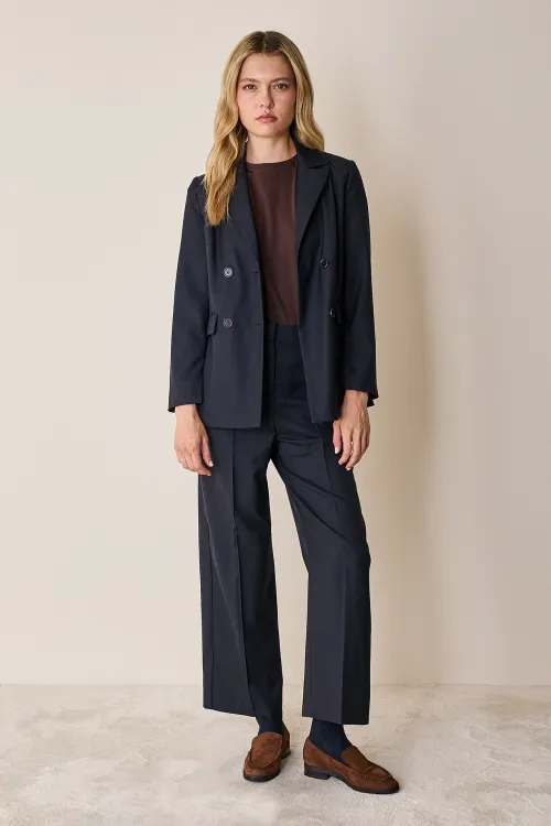 Pantaloni con piega in lana leggera